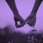 two hands linking pinky fingers together, purple filter.