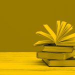 pile of books, yellow filter